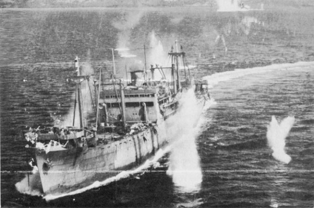 JAPANESE CONVOY UNDER ATTACK in Ormoc Bay. A large transport is straddled by bomb bursts 