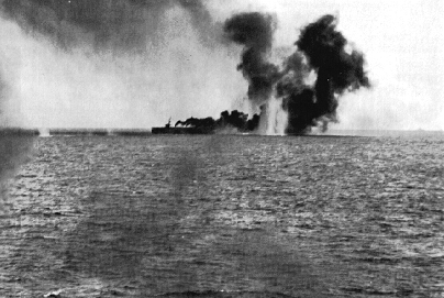 Gambier Bay (CVE-73) under Japanese fire during the Battle of Samar. The smudge in the upper right corner is a Japanese heavy cruiser. US Navy photo. img URL: http://www.navsource.org/archives/03/0307304.jpg