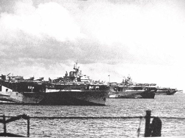 The famous "Murderers Row" at Ulithi lagoon, December 1944, as seen from USS Wasp (CV-18): USS Yorktown (CV-10), USS Hornet (CV-12), and USS Hancock (CV-19).