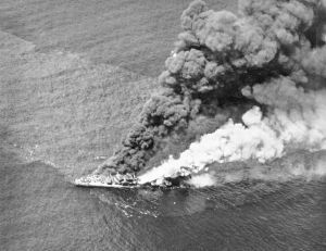 A Japanese destroyer Wakatsuki burns off Leyte, Philippine Islands after being attacked by U.S. carrier planes, 11 November 1944. 350 U.S. Navy aircraft sank the destroyers Hamanami, Naganami, Shimakaze, and Wakatsuki and all the transports of a convoy 80 km north-east of Cebu, Philippines (10.50N 124.35E).